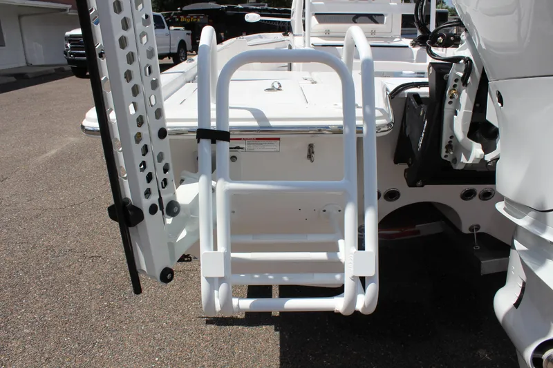 Slide: The Image of 2024 Blue Wave 2200 STL boat with rear ladder and motor. - 13