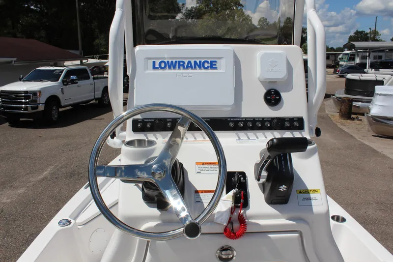 Slide: The Image of 2024 Blue Wave 2200 STL boat console with Lowrance GPS and steering wheel. - 7