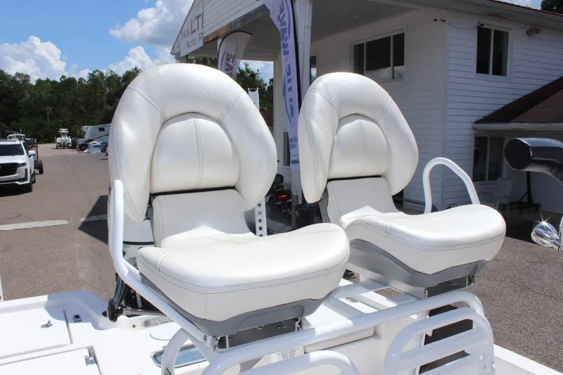 Slide: The Image of 2024 Blue Wave 2200 STL boat with white cushioned seats. - 8