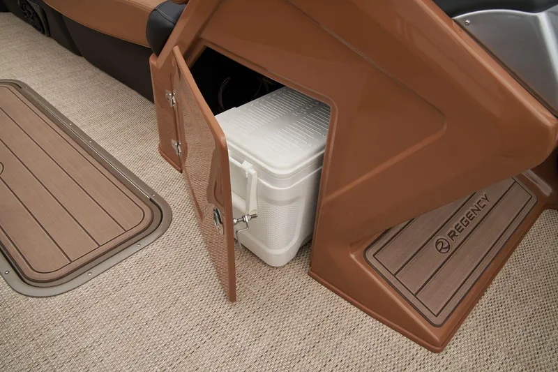 Slide: The Image of 2024 Regency 250 LE3 boat interior storage compartment with cooler. - 32