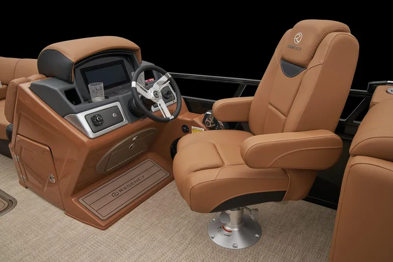Slide: The Image of 2024 Regency 250 LE3 boat cockpit with luxurious captain's chair and modern dashboard. - 37