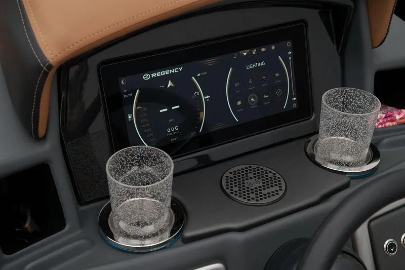 Slide: The Image of 2024 Regency 250 LE3 dashboard with touchscreen display and cup holders. - 43