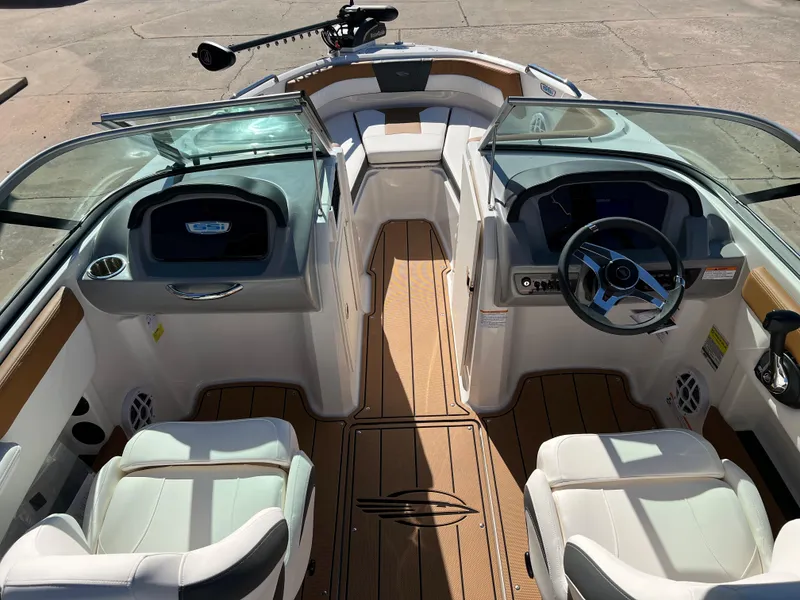 Slide: The Image of 2024 Chaparral 21 SSI SF boat interior with modern dashboard and seating. - 10