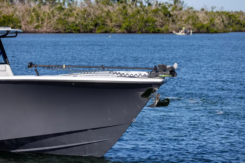 Slide: The Image of 2023 Yellowfin 42 boat on water near shoreline. - 14