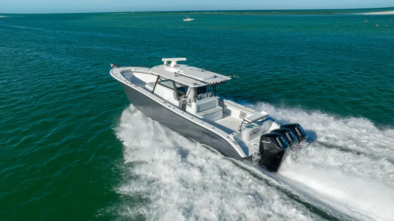 Slide: The Image of 2023 Yellowfin 42 boat cruising on open water. - 18