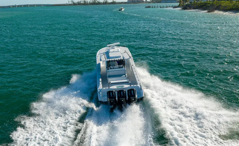 Slide: The Image of 2023 Yellowfin 42 boat cruising on open water. - 19