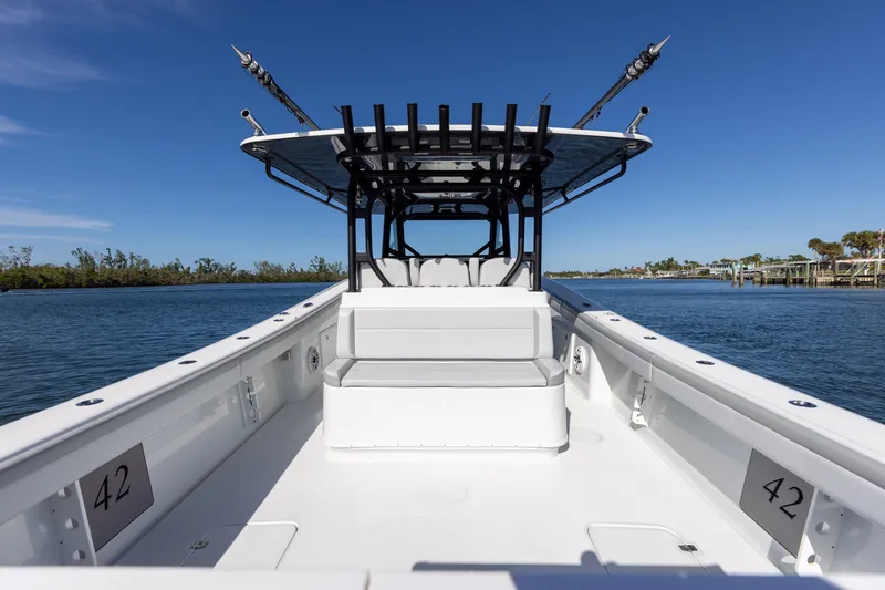 Slide: The Image of 2023 Yellowfin 42 boat with spacious deck and fishing rod holders. - 32