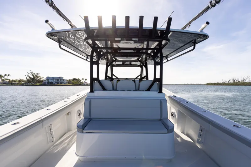 Slide: The Image of 2023 Yellowfin 42 boat interior with seating and T-top on calm water. - 35