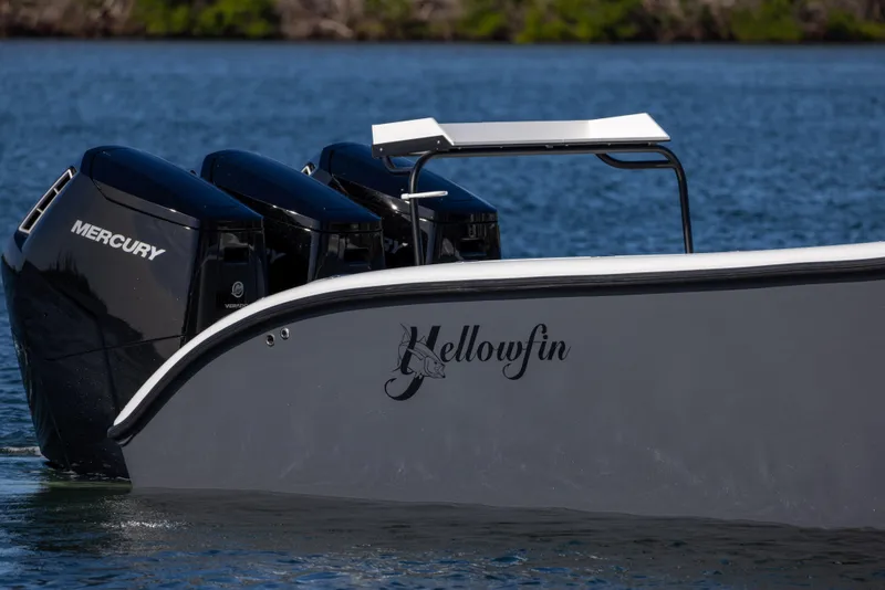 Slide: The Image of 2023 Yellowfin 42 boat with triple Mercury engines on the water. - 4