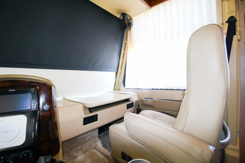 Slide: The Image of Interior of 2012 Thor 37DT RV driver's seat and dashboard. - 17