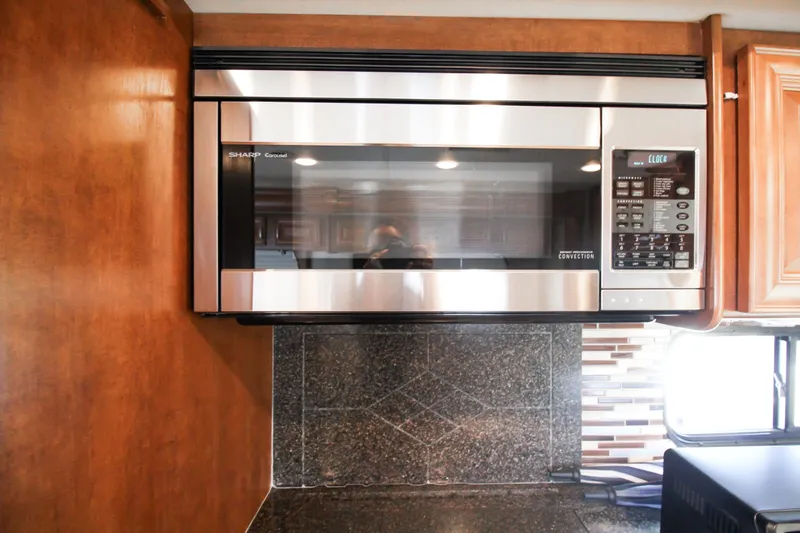 Slide: The Image of Stainless steel microwave in 2012 Thor 37DT RV kitchen. - 8