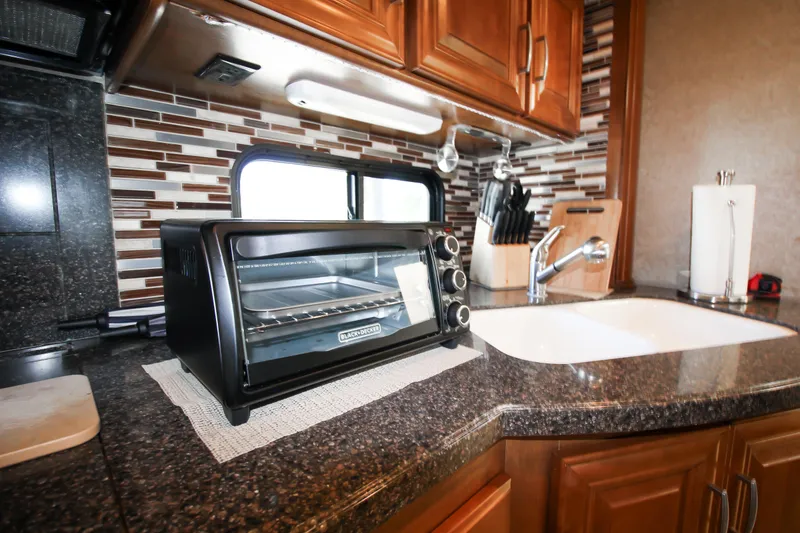Slide: The Image of Modern kitchen in 2012 Thor 37DT RV with toaster oven and sink. - 9