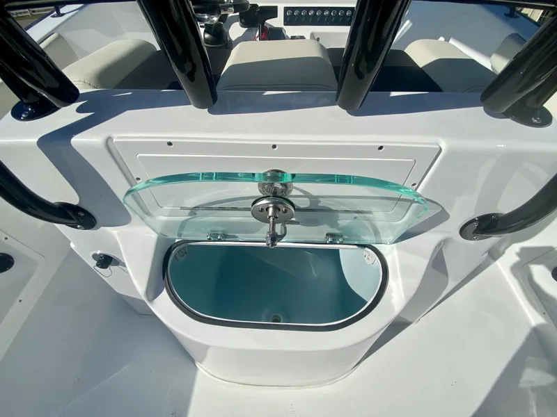 Slide: The Image of 2024 Cape Horn 22OS boat interior with open livewell. - 11