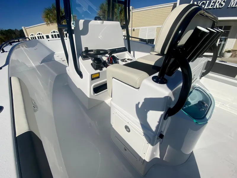 Slide: The Image of 2024 Cape Horn 22OS boat interior with console and seating. - 13