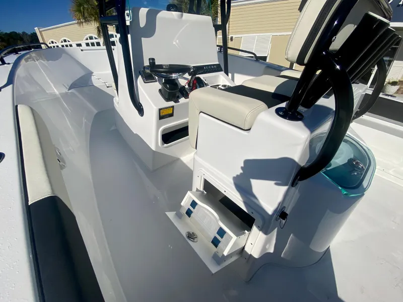 Slide: The Image of 2024 Cape Horn 22OS boat interior with console and seating. - 15