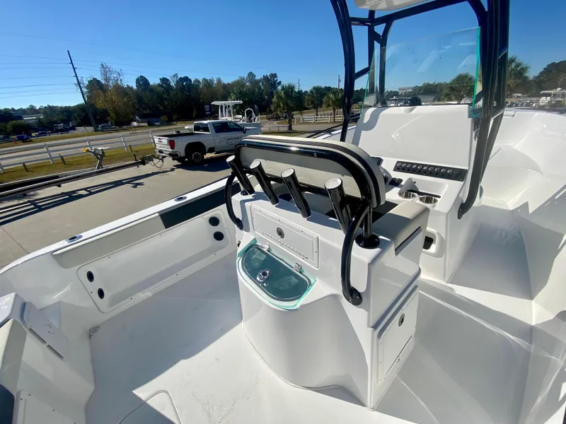 Slide: The Image of 2024 Cape Horn 22OS boat interior with seating and console. - 16