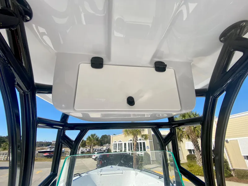 Slide: The Image of 2024 Cape Horn 22OS boat with T-top storage compartment. - 18