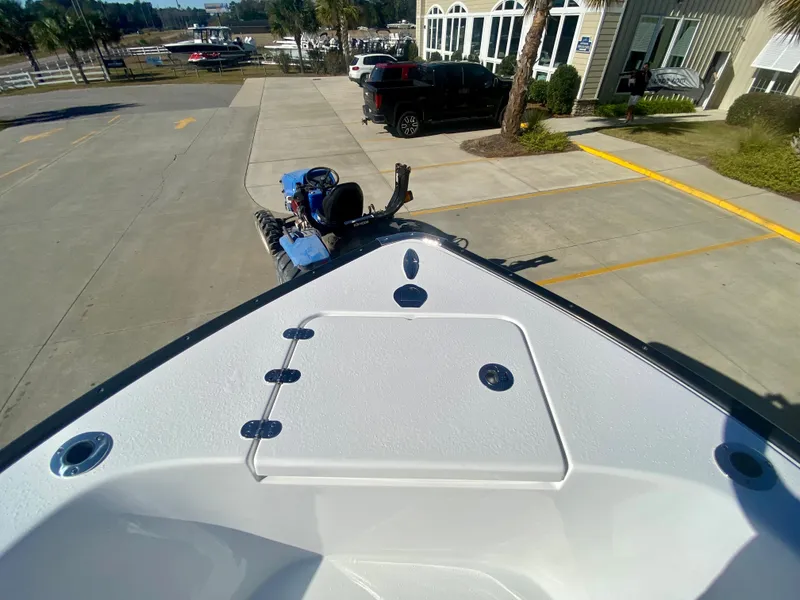 Slide: The Image of 2024 Cape Horn 22OS boat bow view at a dealership. - 23