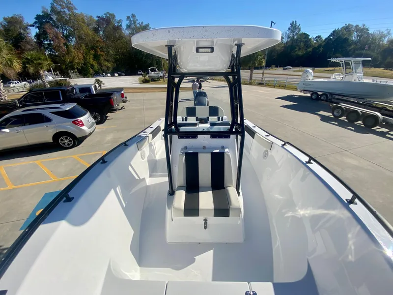 Slide: The Image of 2024 Cape Horn 22OS center console boat in a parking lot. - 27