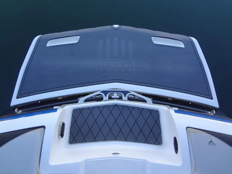 Slide: The Image of 2013 MasterCraft X55 boat interior with gray and black seating. - 10