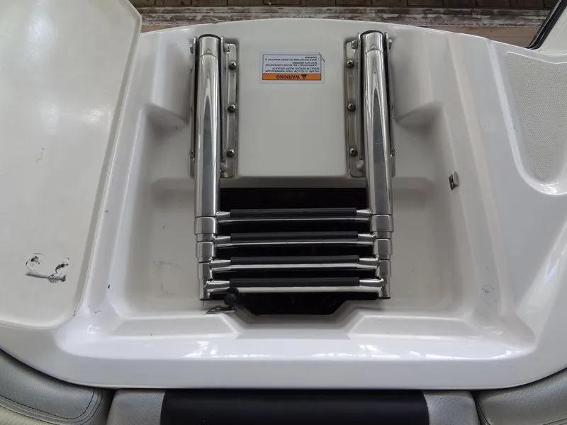 Slide: The Image of 2013 MasterCraft X55 boat interior with spacious seating and advanced audio system. - 15