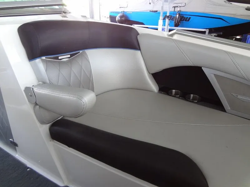 Slide: The Image of 2013 MasterCraft X55 boat interior with gray and black leather seating. - 17