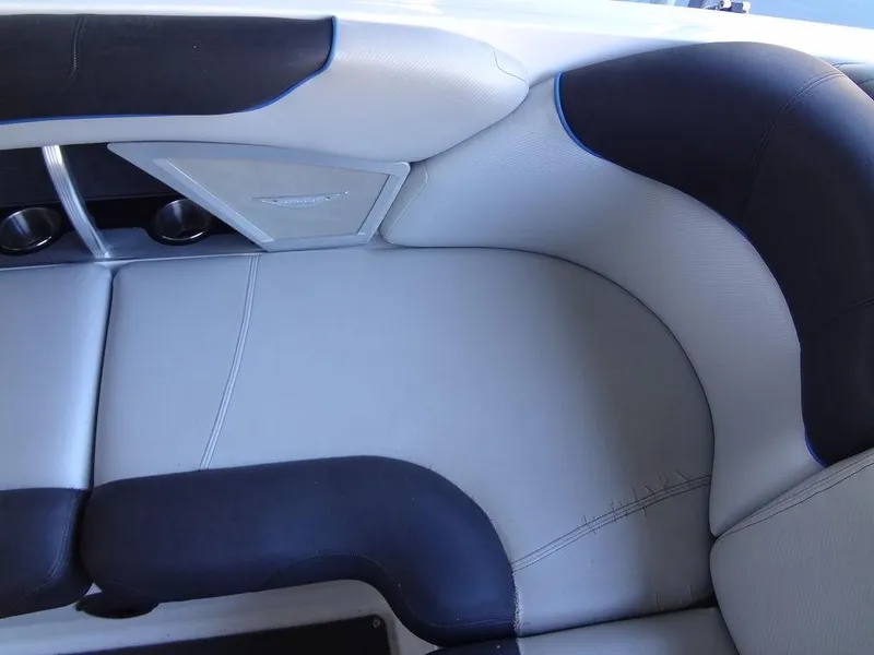 Slide: The Image of 2013 MasterCraft X55 boat interior seating with black and white upholstery. - 21