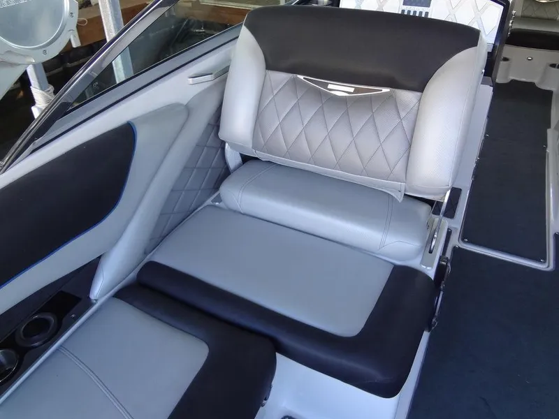 Slide: The Image of 2013 MasterCraft X55 boat interior seating with diamond-stitched upholstery. - 23