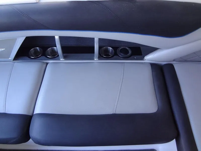 Slide: The Image of 2013 MasterCraft X55 boat interior seating with cup holders. - 24