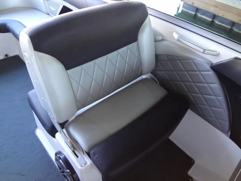 Slide: The Image of 2013 MasterCraft X55 boat interior with luxurious seating and diamond-stitched upholstery. - 26