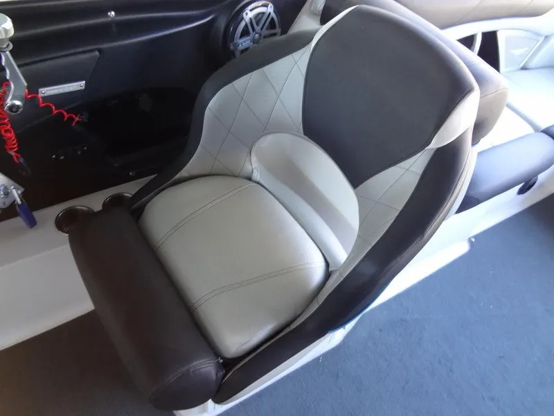 Slide: The Image of 2013 MasterCraft X55 boat interior seating with cup holders. - 27