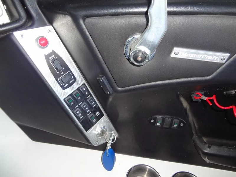 Slide: The Image of 2013 MasterCraft X55 boat battery compartment with ProSport20 charger. - 32