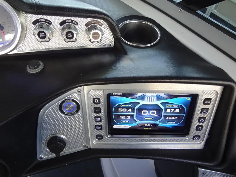 Slide: The Image of 2013 MasterCraft X55 boat dashboard with gauges and control panel. - 34