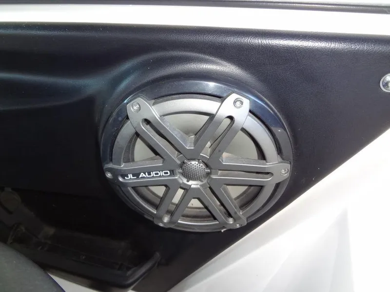 Slide: The Image of 2013 MasterCraft X55 boat dashboard with illuminated gauges. - 36