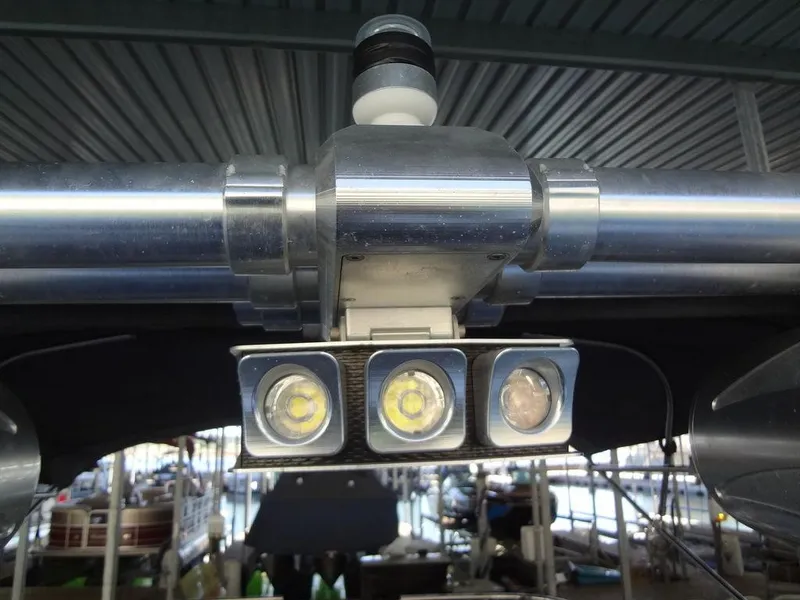 Slide: The Image of 2013 MasterCraft X55 engine compartment with orange engine and various cables. - 51