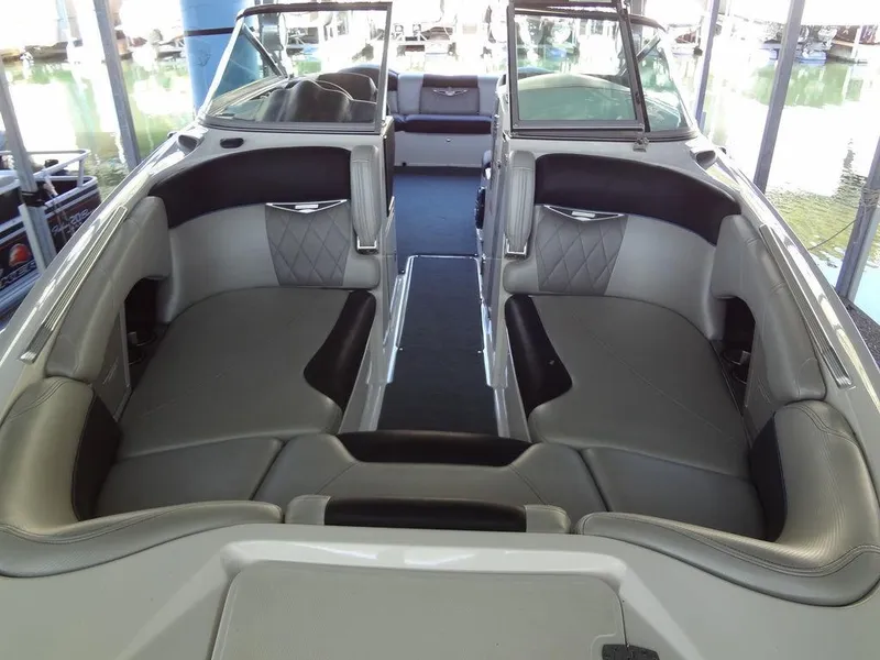 Slide: The Image of 2013 MasterCraft X55 boat docked in a covered marina. - 7