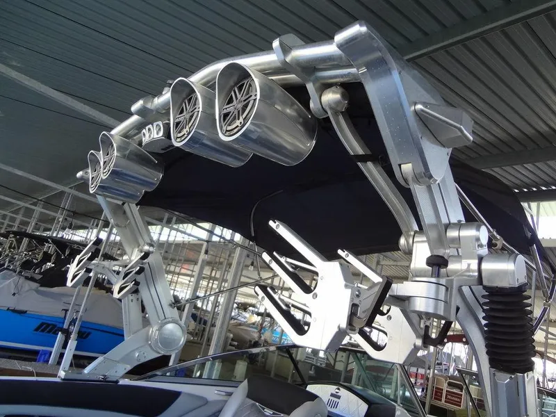 Slide: The Image of 2013 MasterCraft X55 boat docked in a covered marina. - 8