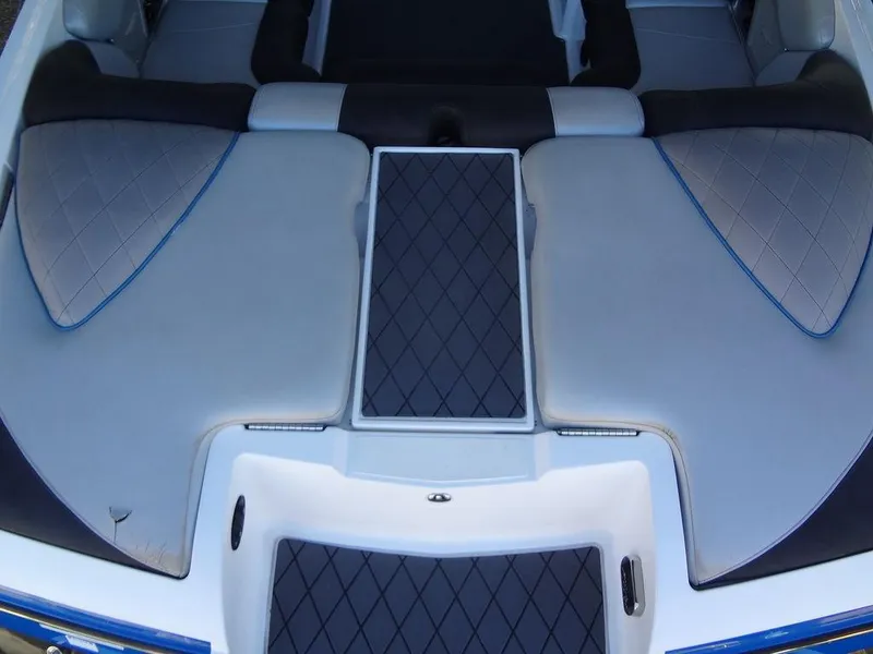 Slide: The Image of 2013 MasterCraft X55 boat interior with advanced sound system and seating. - 9