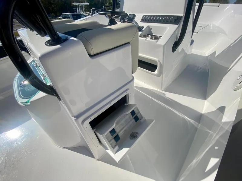 Slide: The Image of 2024 Cape Horn 22OS boat interior with storage compartment and seating. - 14