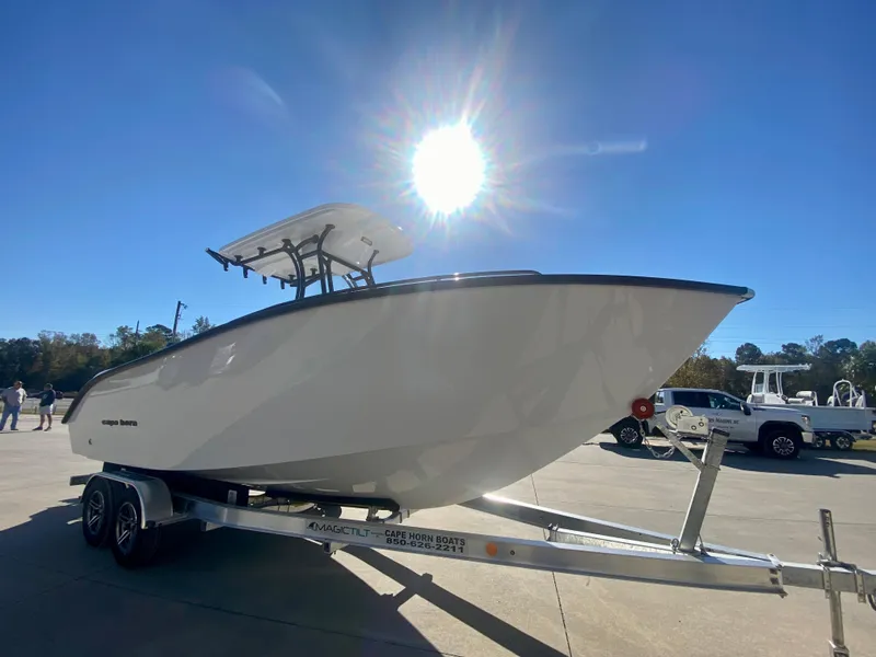Slide: The Image of 2024 Cape Horn 22OS boat on a trailer under bright sunlight. - 2