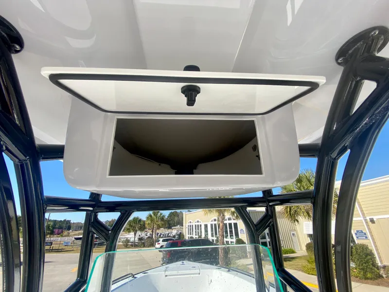 Slide: The Image of 2024 Cape Horn 22OS boat with open overhead storage compartment. - 21