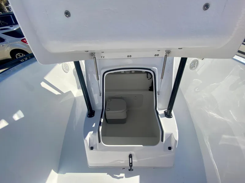 Slide: The Image of 2024 Cape Horn 22OS boat storage compartment with open hatch. - 24