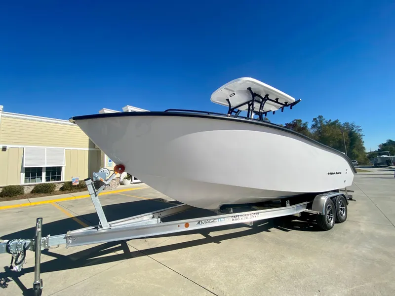 Slide: The Image of 2024 Cape Horn 22OS boat on a trailer under clear blue sky. - 5