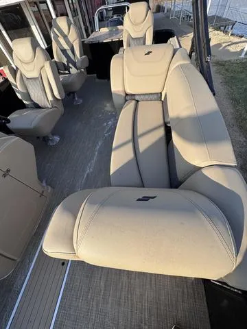 Slide: The Image of 2023 Starcraft CX23FD boat interior with beige seating and modern design. - 13