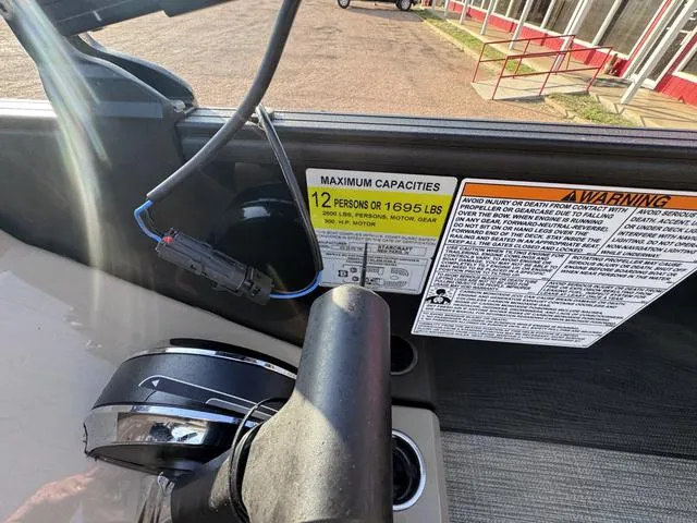 Slide: The Image of Starcraft CX23FD 2023 boat capacity label, maximum 12 persons or 1695 lbs. - 17