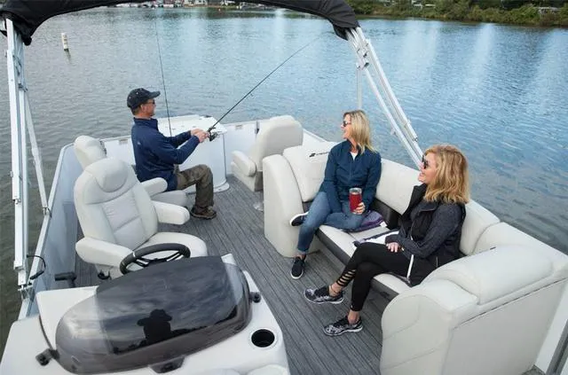 Slide: The Image of People enjoying a fishing trip on a 2023 Starcraft CX23FD boat. - 26