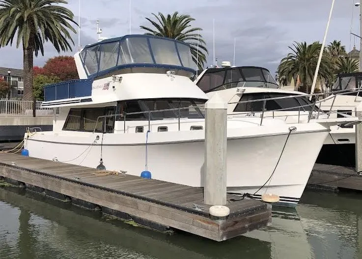 Slide: The Image of Ocean Alexander Classico 450 yacht, 1999 model, docked at marina with palm trees. - 1