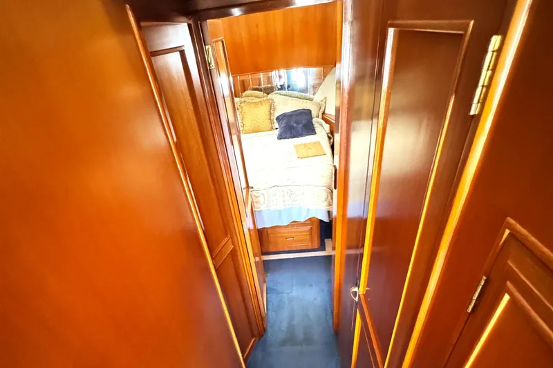 Slide: The Image of Cozy cabin interior of 1999 Ocean Alexander Classico 450 yacht with wooden finish. - 16