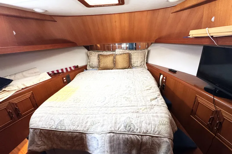 Slide: The Image of Luxurious cabin interior of 1999 Ocean Alexander Classico 450 yacht with cozy bedding. - 17