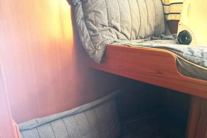 Slide: The Image of Interior cabin of 1999 Ocean Alexander Classico 450 with wooden paneling and cushioned seating. - 18